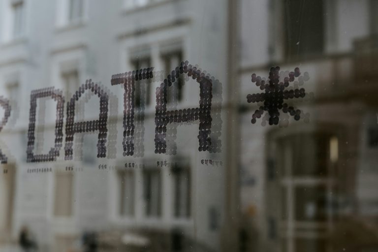 DATA text on glass window representing data-driven leadership