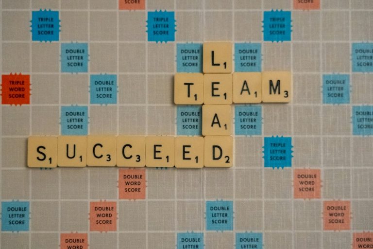 Scrabble tiles spelling team and succeed, representing how organizations build a data culture